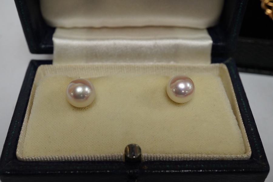 Three pairs of cultured pearl stud earrings, largest 9.3mm diameter, a pair of sleeper earrings, a gold and cultured pearl flower head pendant, stamped 9ct, with a gilt metal chain